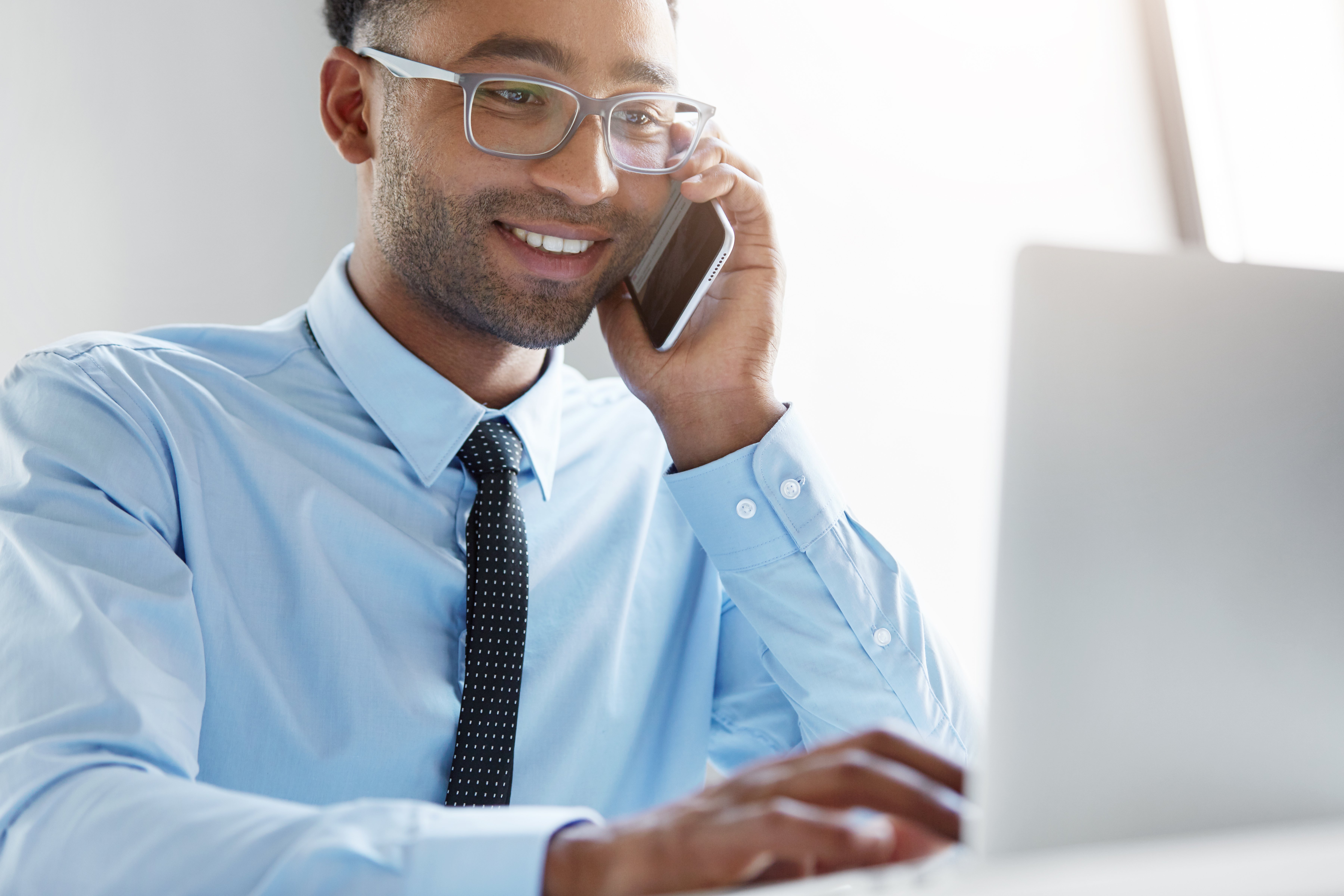 confident-businessman-working-his-laptop