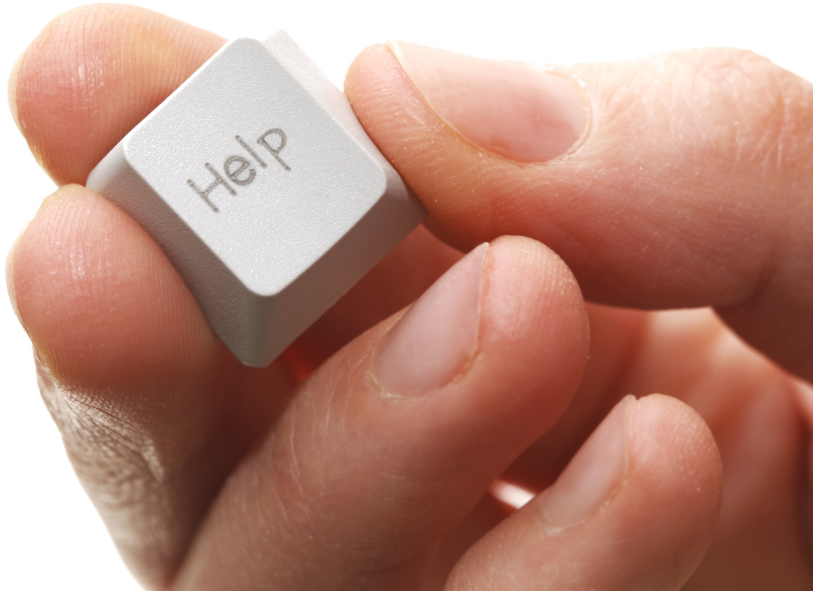 picture of a hand holding a keyboard key that says help support