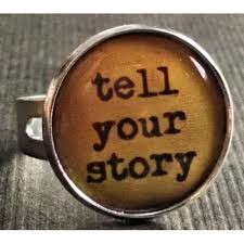 picture of a cuff link that says "tell your story" story