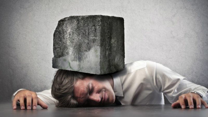 picture of a man with a rock on top of him under pressure - donors