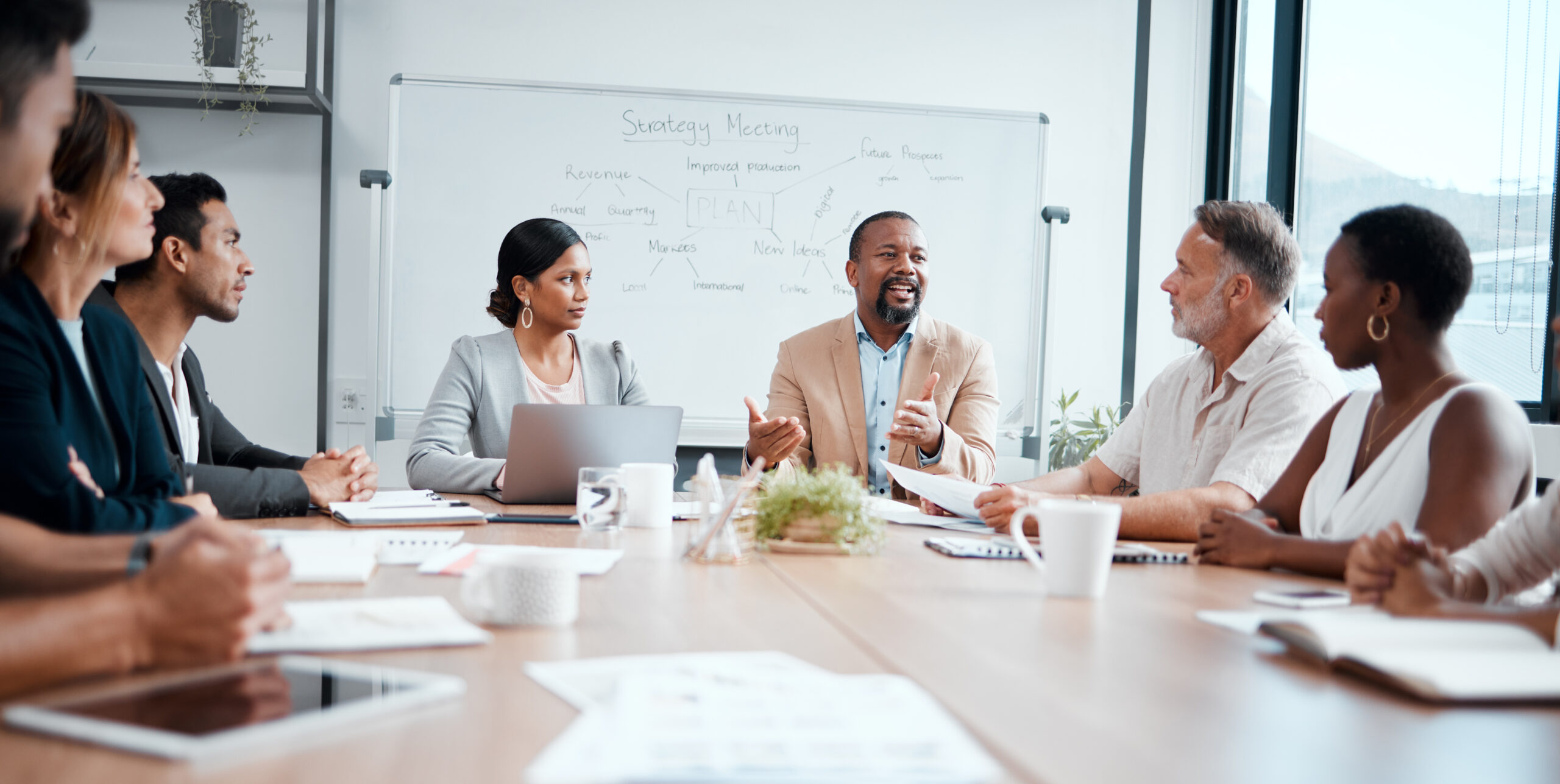 Board members discuss strategy at meeting. [How to Secure Board Members Who Really Work]