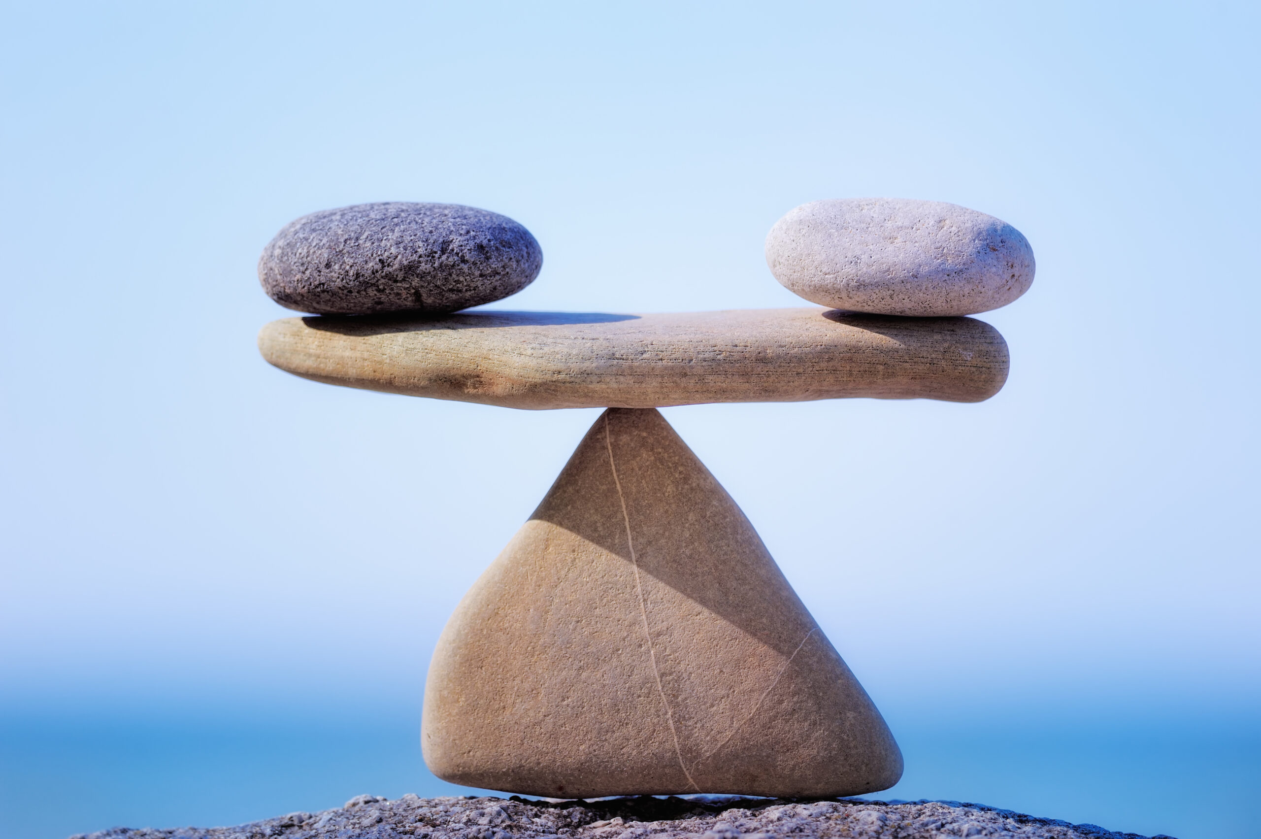 Rocks of equal weight are balanced on a point [Work-Life Balance Is Not Real!]