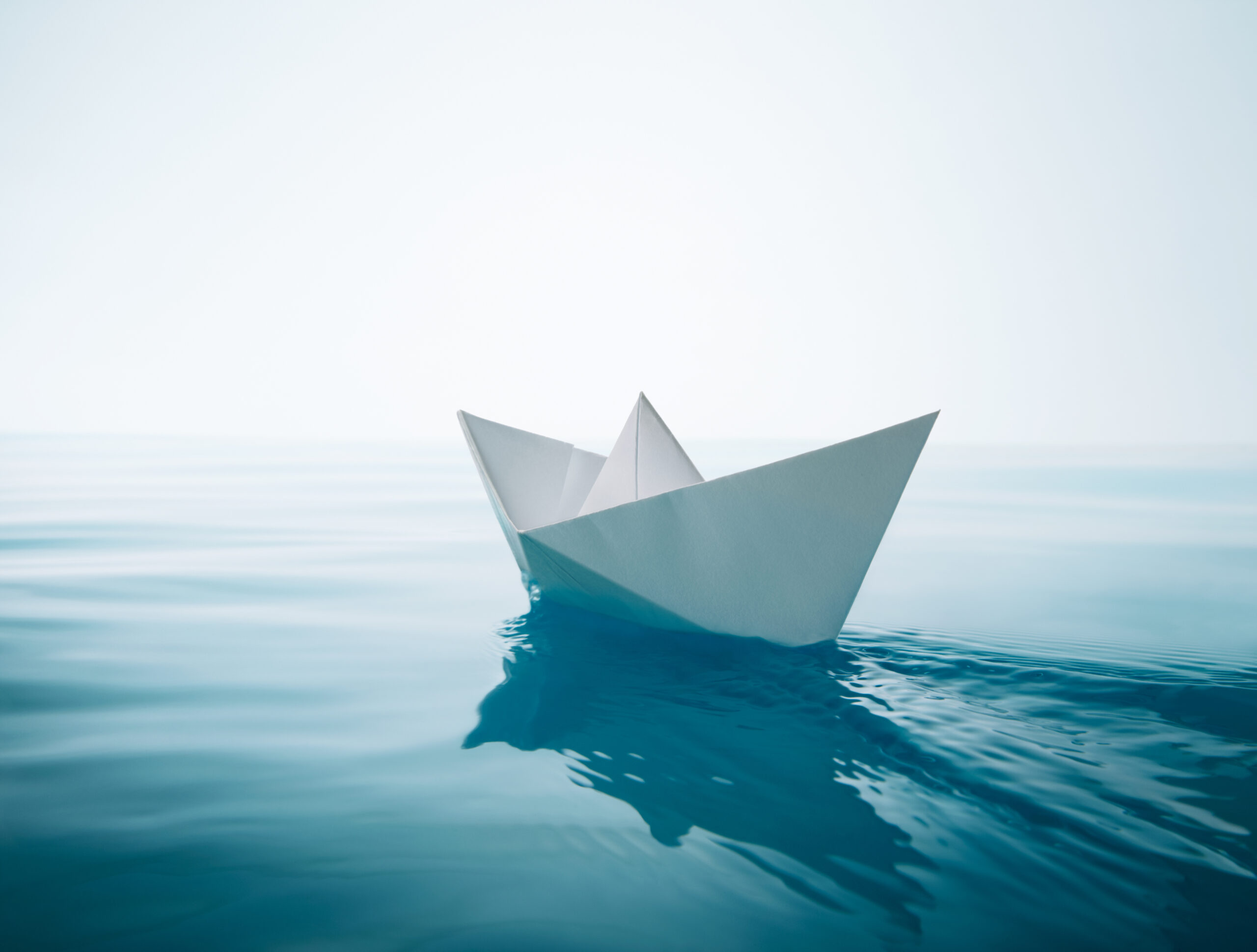 A paper boat sailing [The Wind is at Your Back. What are YOU Going to do?]